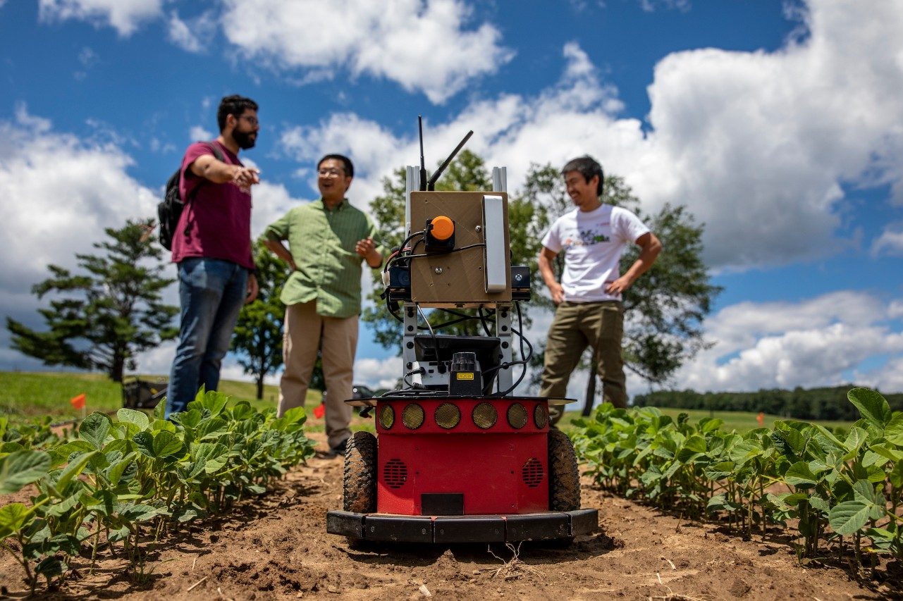 researchers in field with equipment